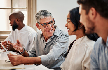 Poster - The talent to keep business booming. Shot of a mature businessman using a digital tablet during a meeting in a modern office.
