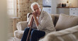 © Kobus L/peopleimages.com - Where did all the time go. Shot of a senior man sitting alone on the sofa at home and looking contemplative while holding his walking stick.