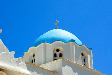 Wall Mural - On the island of Tinos, in the Cyclades, in the heart of the Aegean Sea and at the foot of mount exobourgo, view of the blue dome of the orthodox church in the village of Tripotamos