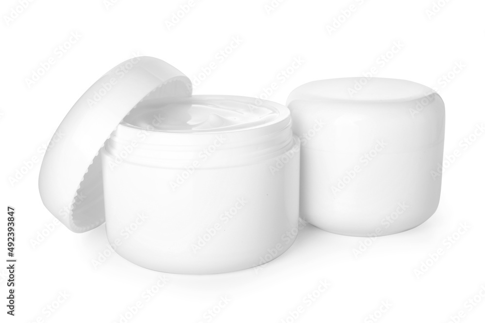 Jars with natural cosmetic cream isolated on white background