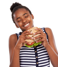 This A Darn Good Sandwich. Shot Of A Happy Young African American Girl Holding A Salad Sandwich Isolated On White.