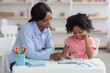 © Prostock-studio - Child development specialist working with little girl
