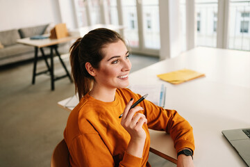 Thoughtful businesswoman, pondering ideas, developing business strategy in office