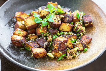 Wall Mural - Stir-fried black tofu with chili, salt, garlic and pepper. Authentic the rare black tofu found only in Ratchaburi, Photharam Village, Thailand. Balance salty and sweet stew with sweet herbal gravy.