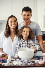 Sticker - A bond everyone strives for. Portrait of an adorable little girl baking with her parents at home.