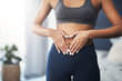 © Allistair/peopleimages.com - You gotta show love to your body. Cropped shot of an unrecognizable young woman making a heart shape on her stomach in her bedroom.