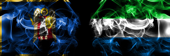 Kyiv, Kiev vs Sierra Leone flag. Smoke flags placed side by side isolated on black background.