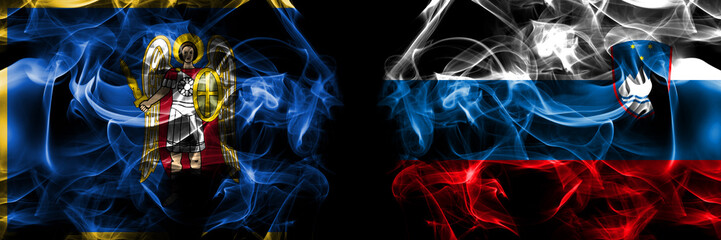 Kyiv, Kiev vs Slovenia, Slovenian flag. Smoke flags placed side by side isolated on black background.