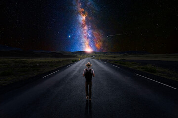 Wall Mural - lonely man walking down a long road