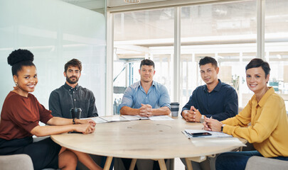 Poster - Were here to prove the excellence of our company. Portrait of a group of businesspeople having a meeting in an office.