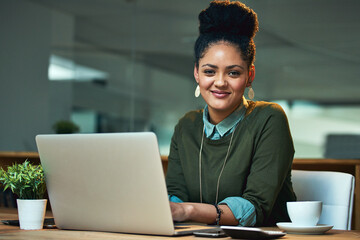 Poster - This project is my number one priority. Portrait of an attractive young woman working on her laptop in the office.