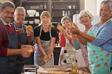 Good Cooks Never Lack Friends. Shot Of A Group Of Seniors Attending A Cooking Class.