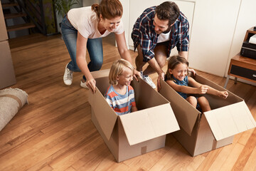 Poster - There is an adventure in moving house. Shot of a young family on their moving day.