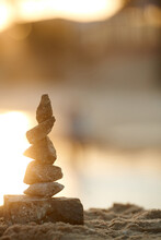 Stack Of Stones On Beach Against Blurry Background