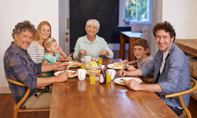 Poster - Good food and family - a recipe for happiness. A portrait of a happy multi-generation family having breakfast together at home.