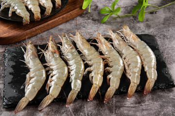 Wall Mural - fresh raw white shrimps or prawns on table