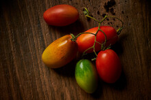San Marzano Tomatoes Lying On Wooden Surface