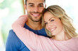 © Daniel L/peopleimages.com - At a great place in our lives. Portrait of an affectionate young couple at home.