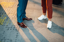 Business Colleagues Wearing Shoes Standing On Footpath