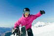 © Westend61 - Happy man with hand raised enjoying at ski resort on sunny day