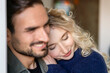 © Westend61 - Smiling young woman with blond hair embracing boyfriend