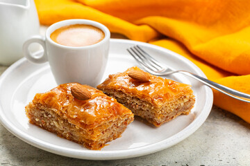 Poster - Middle Eastern and Mediterranean Baklava and espresso coffee. Layered pastry dessert made of filo pastry, filled with chopped almond nuts, and sweetened with syrup or honey.  Homemade.