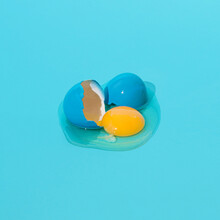 Easter Blue Egg On A Blue Background. Surreal Aesthetic Egg Concept.