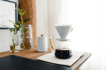 Wall Mural - Drip coffee,Pouring a hot water over a drip coffee on the table