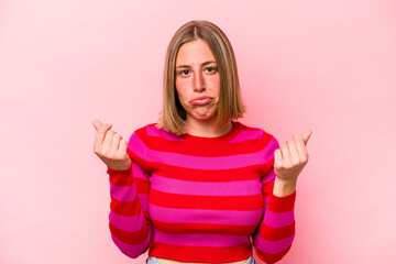 Wall Mural - Young caucasian woman isolated on pink background showing that she has no money.