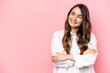 © Asier - Young caucasian woman isolated on pink background smiling confident with crossed arms.