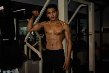 Fitness man exercise training warm up body and posing in gym,Healthy lifestyle.