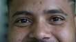 © Marco - A hispanic black man eyes close-up face smiling looking at camera
