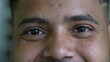 © Marco - A hispanic black man eyes close-up face smiling looking at camera