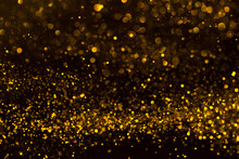 Abstract Background Of Sparkling Shiny Golden Glitter Particles