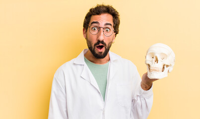 Wall Mural - young physician holding a skull