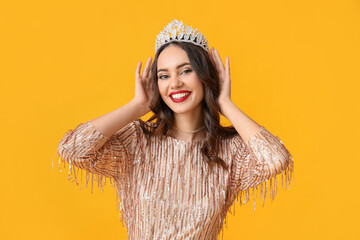 Canvas Print - Beautiful young woman in stylish dress and tiara on yellow background