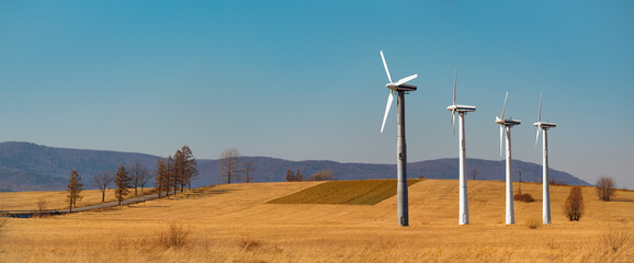 ecological wind farms standing against the backdrop of a landscape in europe