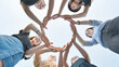 © Довидович Михаил - Friends make a circle with their palms against the blue sky.