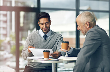 Aufkleber - Take a look at these numbers. Cropped shot of two businessmen looking over some paperwork in the office.