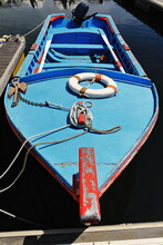 Blue Wooden Fishing Boat Afloat-harbor's Dark Water-moored To Pontoon. Faro-Portugal-138