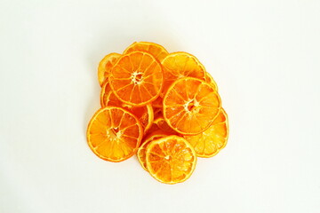 Wall Mural - dry orange citrus fruits slice for snack,decoration,food,health related concept on white background with copy space