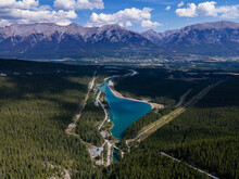 Aerial View From The Grassi Lakes Trail In Canmore, Canada. Mountains In The Background Overlooking A Turquoise Lake Surrounded By Trees. 