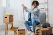 © SHOTPRIME STUDIO - handsome guy unpacking things from boxes in the room interior