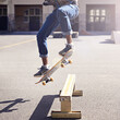 © T Hover/peopleimages.com - Hes got moves. Cropped shot of a young man doing a skateboarding trick.