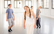 © JackF - Group of teenagers performing unusual modern dance indoors