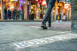 Tile Street sign for the famous Bourbon Street in the French Quarter. For effect, shallow focus is on the right side of the 