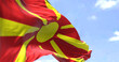 Detail of the national flag of North Macedonia waving in the wind on a clear day