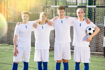 Wall Mural - Group portrait of smiling male soccer team