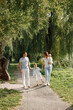 © hetmanstock2 - Photo of a family walking in a park on summer