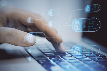 close up of male hands using laptop computer with abstract big data and security nodes on blurry bac